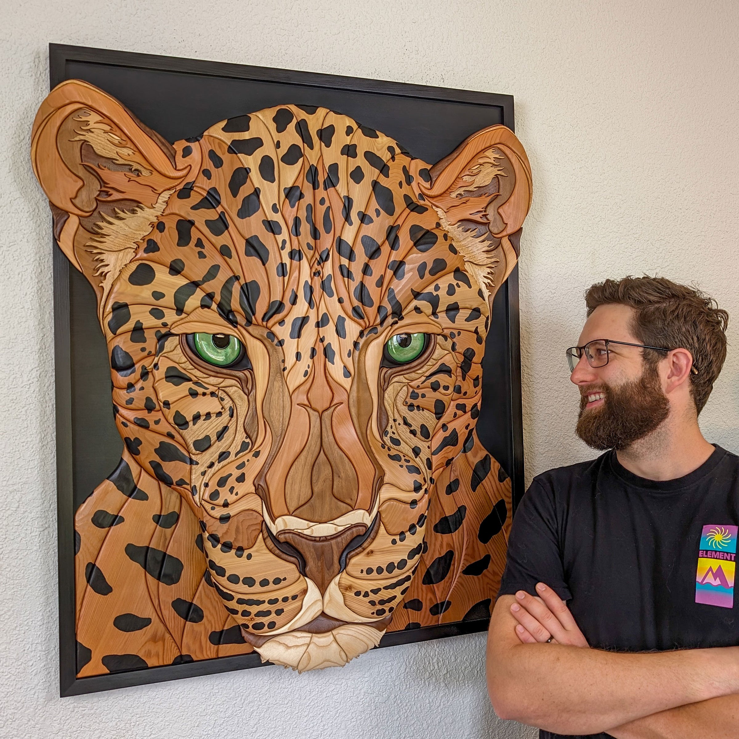 Alex Jepson with his handcrafted jaguar wood sculpture, showcasing intricate carving techniques and nature-inspired artistry. A one-of-a-kind, premium piece for discerning art collectors seeking exclusive, high-quality artwork.