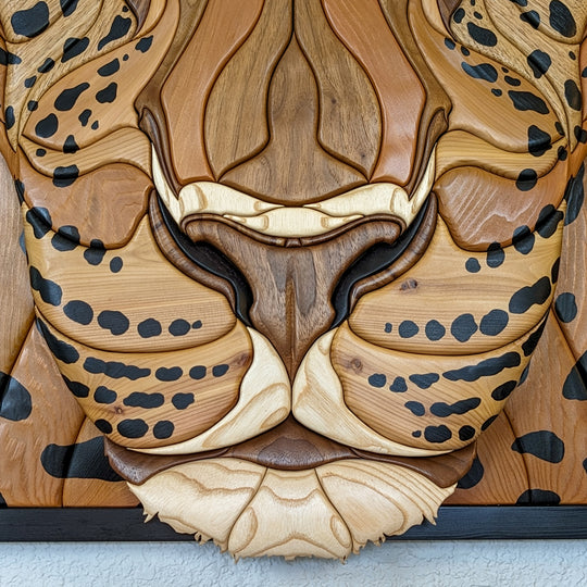 Textured details of jaguar wood sculpture by Alex Jepson, emphasizing nature-inspired design and fine wood carving.