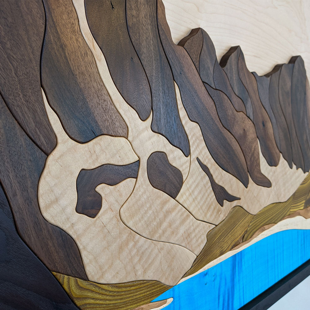 Detailed close-up of Moraine Lake Banff wood sculpture by Alex Jepson, highlighting intricate textures and high-quality carving craftsmanship.