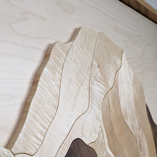 Detailed close-up of Mount Robson and Berg Lake wood sculpture by Alex Jepson, showcasing intricate textures and high-quality carving craftsmanship.
