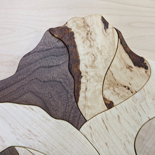 Close-up of Mount Robson and Berg Lake wood sculpture by Alex Jepson, highlighting the natural wood grain and showcasing high-quality materials and expert craftsmanship.