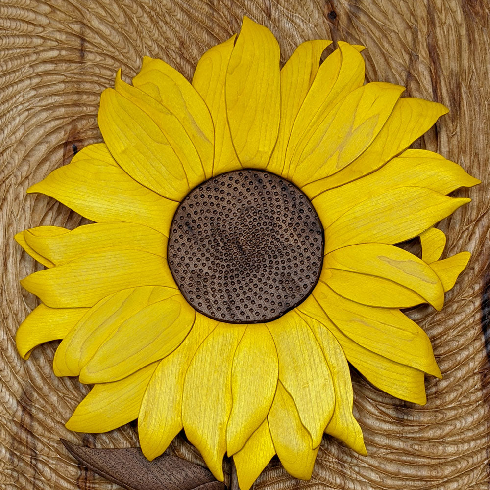 Close-up of Starry Night Sunflower wood sculpture by Alex Jepson, showcasing intricate carving details and vibrant textures in this nature-inspired artwork.