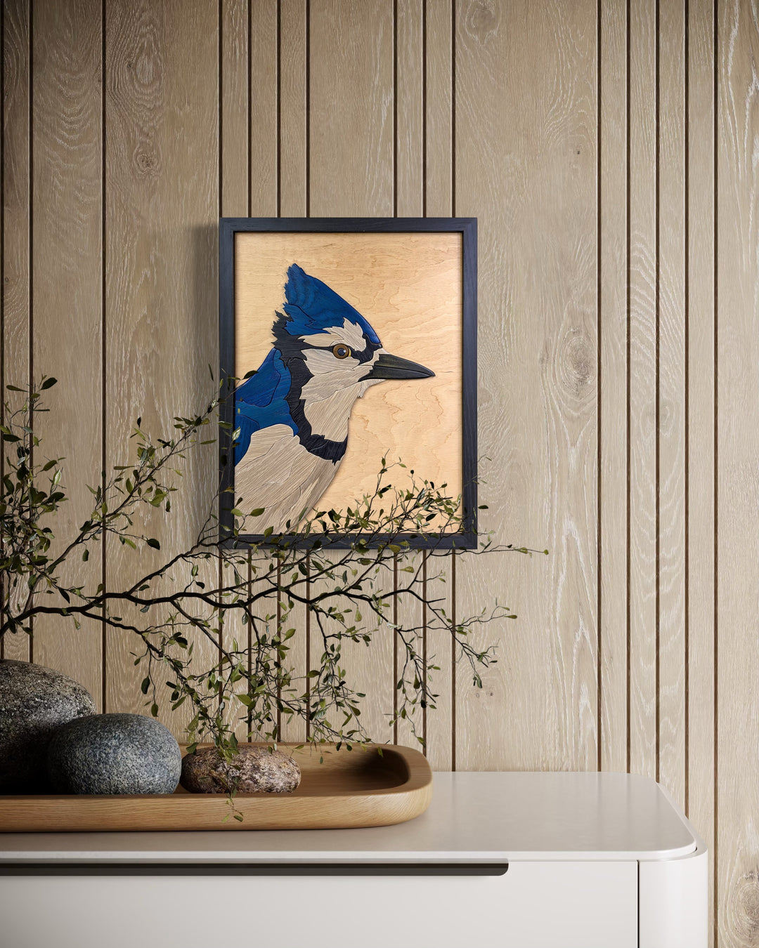 Watchful Blue Jay wood sculpture by Alex Jepson in a luxury home interior, perfect for nature-inspired décor, featuring vibrant bird details and fine craftsmanship.