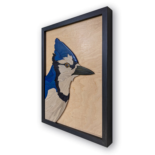 Watchful Blue Jay bird wood sculpture by Alex Jepson, highlighting the natural beauty and fine craftsmanship of the blue jay in a nature-inspired artwork.