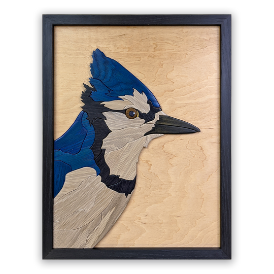 Full view of Watchful Blue Jay wood sculpture by Alex Jepson, showcasing intricate details and expert craftsmanship of the vibrant blue jay perched gracefully.